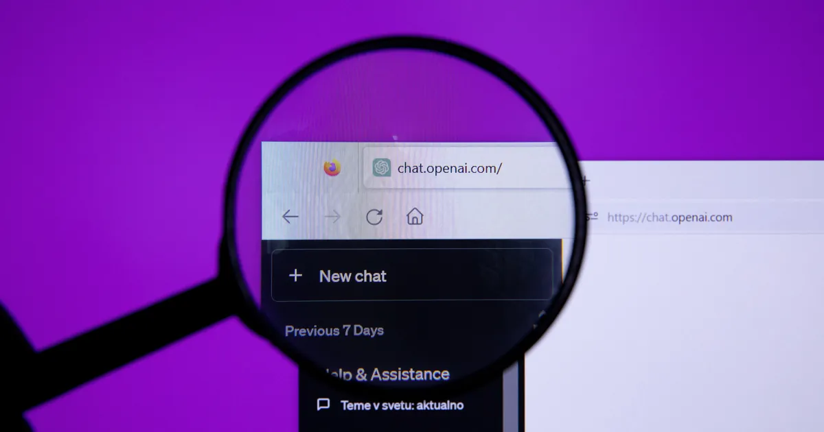 A magnifying glass held over a browser address bar showing the ChatGPT web address and its sidebar