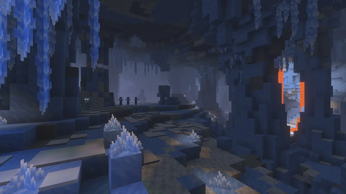 A dark blue cave with icicles hanging from the ceiling, pale ice crystals on the floor and a lava fall glowing orange on the right