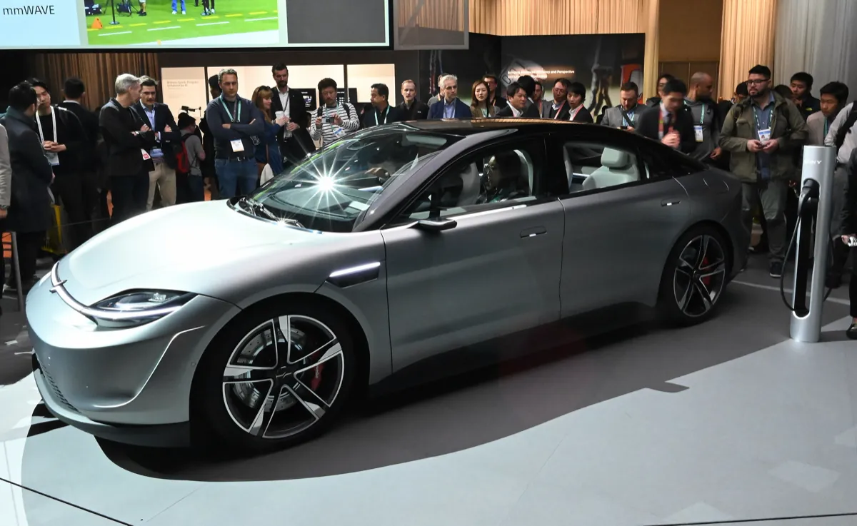 Silver Sony Vision-S concept car on display surrounded by visitors at CES 2020