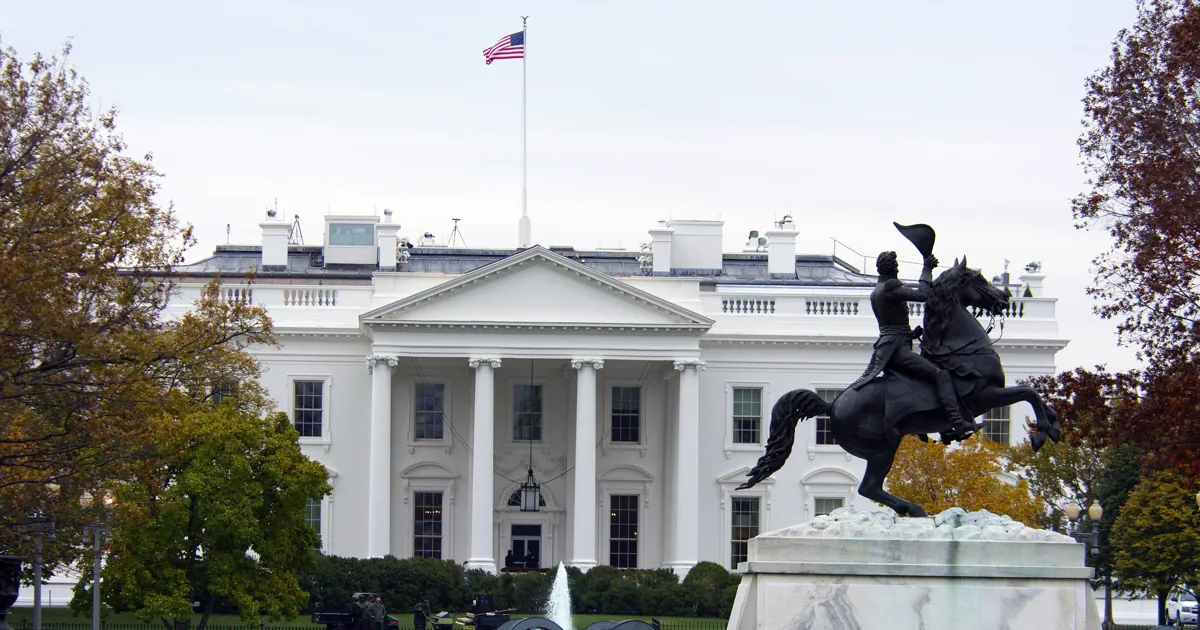 The North Portico of the White House in autumn, with the Andrew Jackson statue in Lafayette Square in the foreground