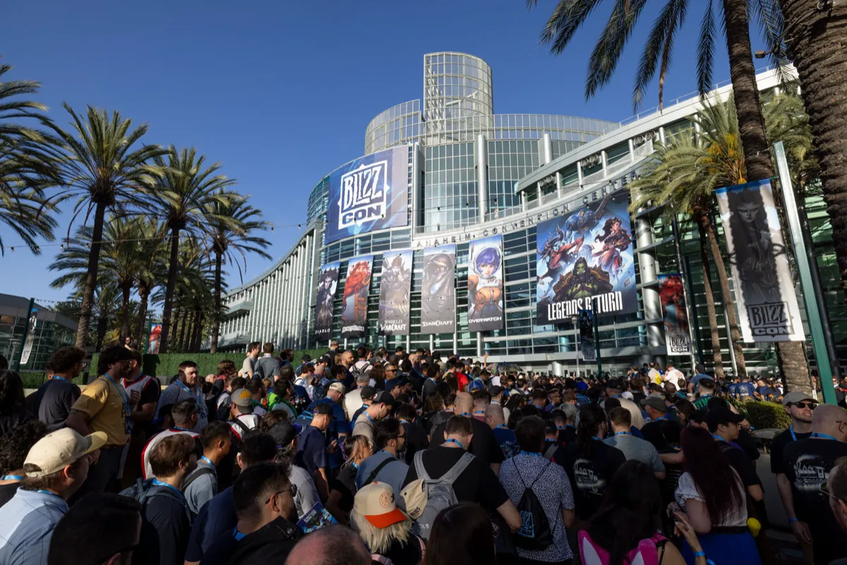 Crowds outside the Anaheim Convention Center under BlizzCon banners and palm trees